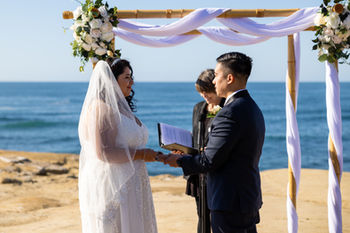 Sunset Cliffs wedding ceremony package with bamboo chuppah and non-denominational wedding officiant.