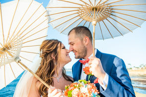 Full service wedding packages for Sunset Cliffs include aesthetic paper parasols.
