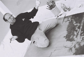Lawrence Gipe working a large aluminum plate on the floor at Atelier Richard Tullis 2005. Photo: © 2004 Richard Tullis