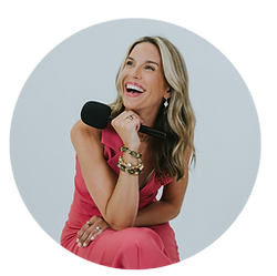 Erica Rooney smiling with a microphone in hand