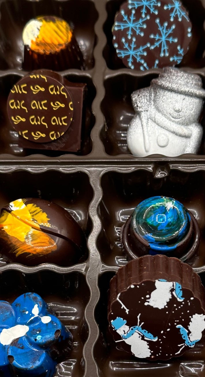 8 unique chocolate pieces in blue, yellow, white