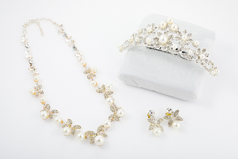 Pearl and rhinestone necklace, tiara, and earrings