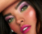 a woman with pink and green eyeshadow