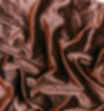 close up of a piece of dark gold brown velvet fabric