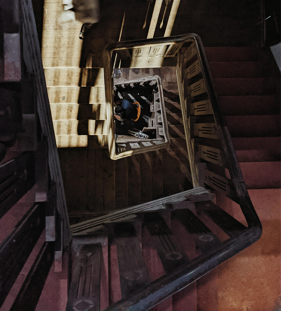 a wooden spiral staircase seen from above