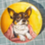 Hand-painted ceramic bowl with a cartoon-style dog portrait and orange accents, handmade by Paw Paw Tree 2