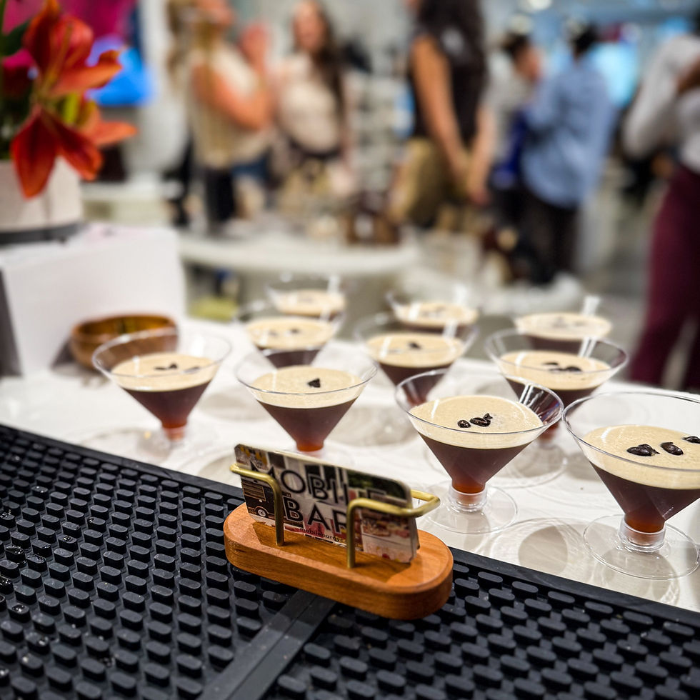 High angle view of a mobile bar team setting up elegant glassware and bottles