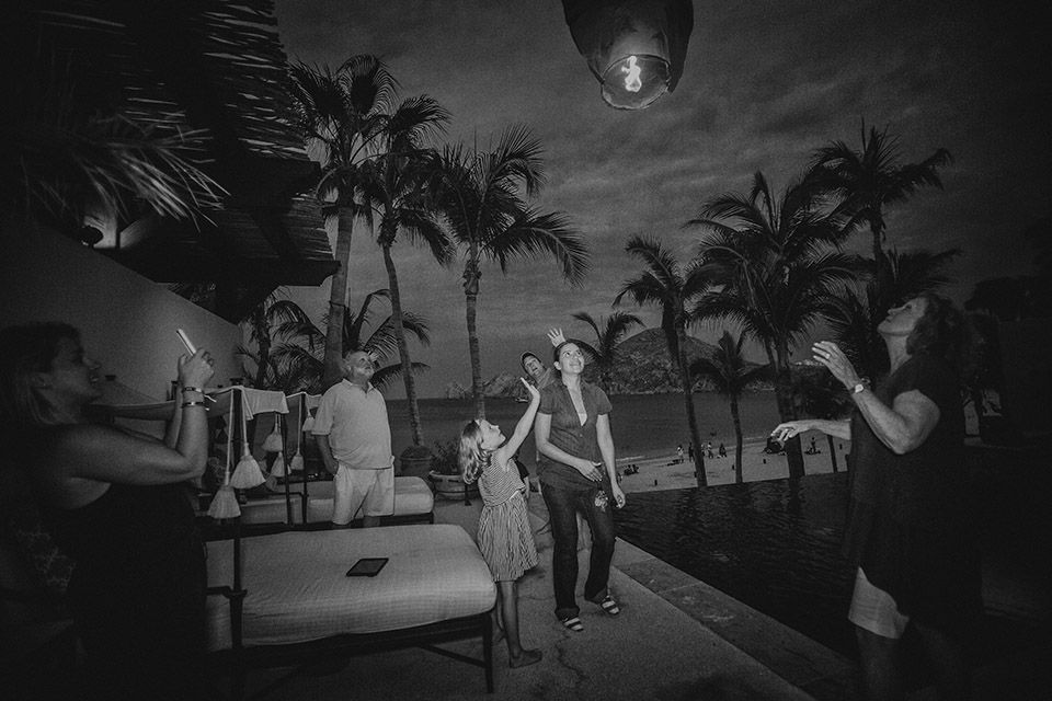 family releasing lanterns in cabo, naay travel, los cabos experiences, villas in cabo, unique experiences cabo, celebrate in cabo