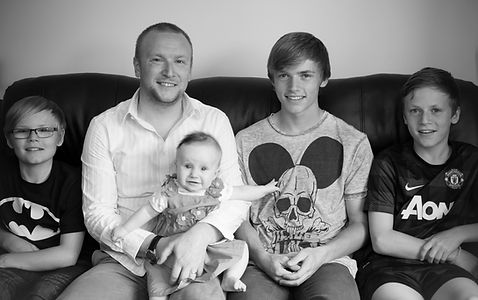 A photo of Dean Elliott and his children, Devon wedding and commercial photographer from Devon