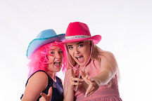 two girls posing in photo booth