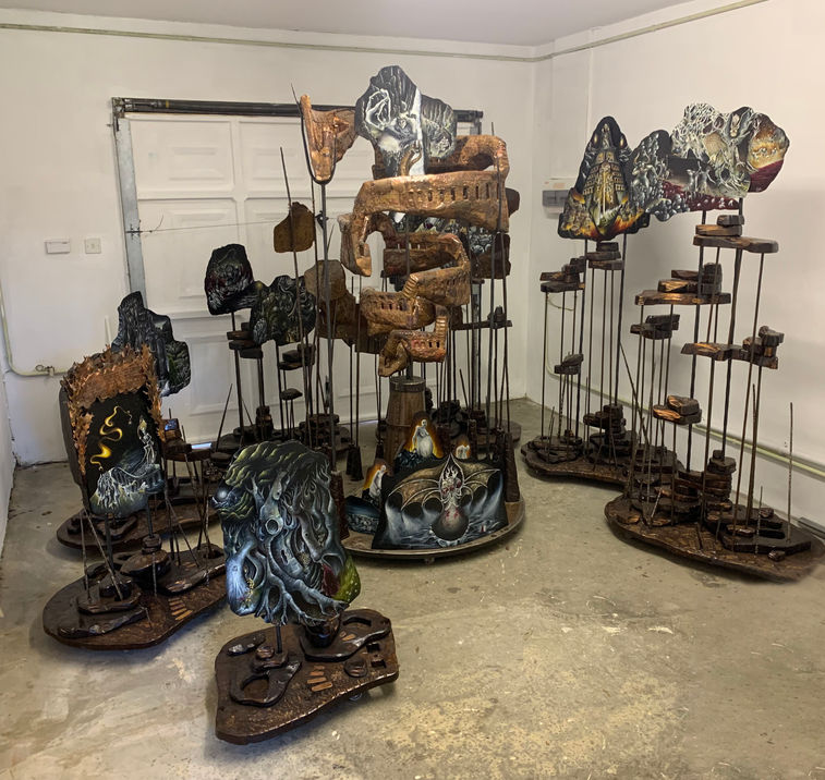 Complete Dante’s Inferno installation by Julia O’Sullivan, with seven surrounding sculptural plinths ascending in height towards the monumental copper Eighth Circle before descending into the Ninth Circle and Lucifer at the centre of Hell.