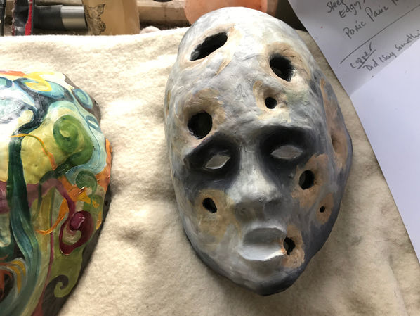 Dementia Head by Julia O’Sullivan during the painting process as layers of oil paint begin developing across the sculpted face.