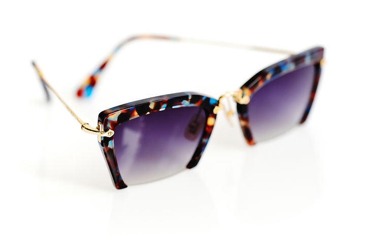 stylish-women-s-sunglasses-on-white-background-2023-11-27-05-27-33-utc.jpg