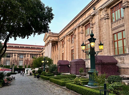 Visitors admiring the famous Alexander Sarcophagus and other ancient artifacts inside the grand halls of the Istanbul Archaeology Museums.