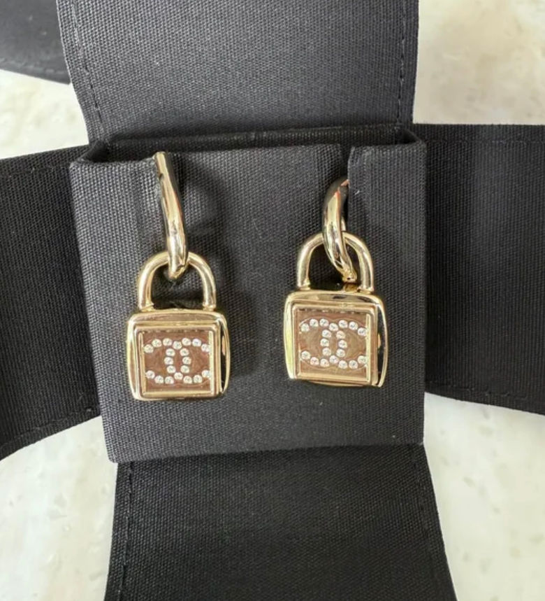 Thumbnail: CHANEL Metal CC Lock Drop Earrings (never worn)