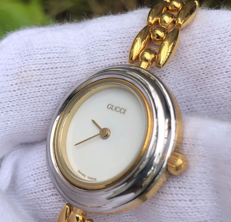Thumbnail: GUCCI's change bezel bracelet type gold plated watch.