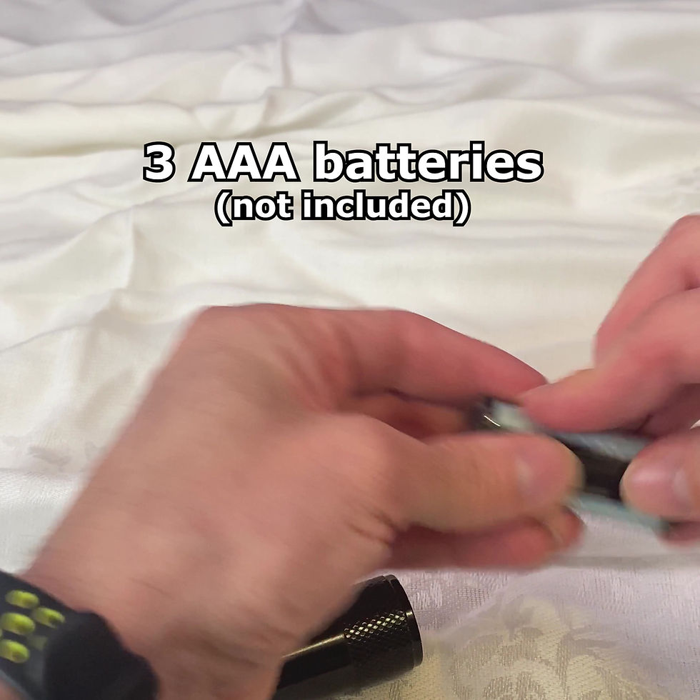 Miniature : Hands demonstrating how to insert AAA batteries into the Glowkind Torch