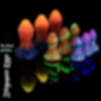 Three Dragoness Egg toys in different colors and sizes displayed on a dark reflective surface, with their phosphorescent glow
