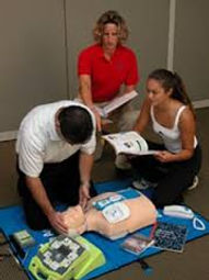 Three people simulating Pediatric Advanced Life Support (PALS)