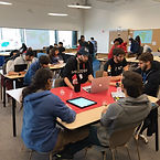 students participating in hackathon in real life.jpg
