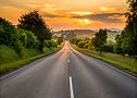 —Pngtree—serene countryside highway at sunset_15967469.jpg