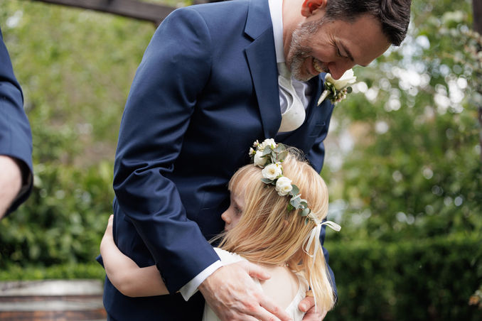 Groom with flowergirl at Canberra wedding ceremony - Bec & Matt with Canberra celebrant debbie taylor