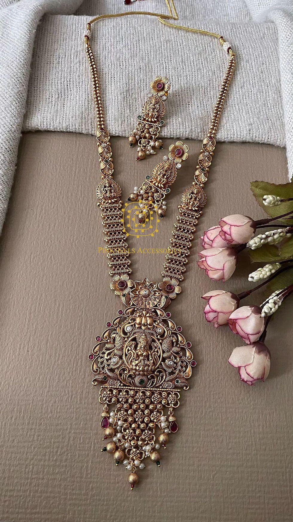 Traditional long matte gold necklace with intricate design
