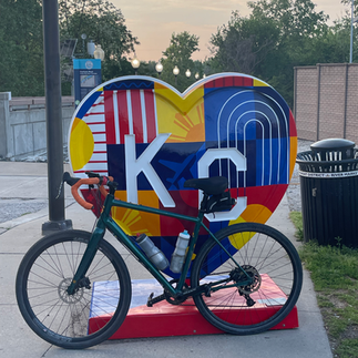 Bicycle in front of a KC Heart sculpture during Kansas City’s Parade of Hearts public art installation.