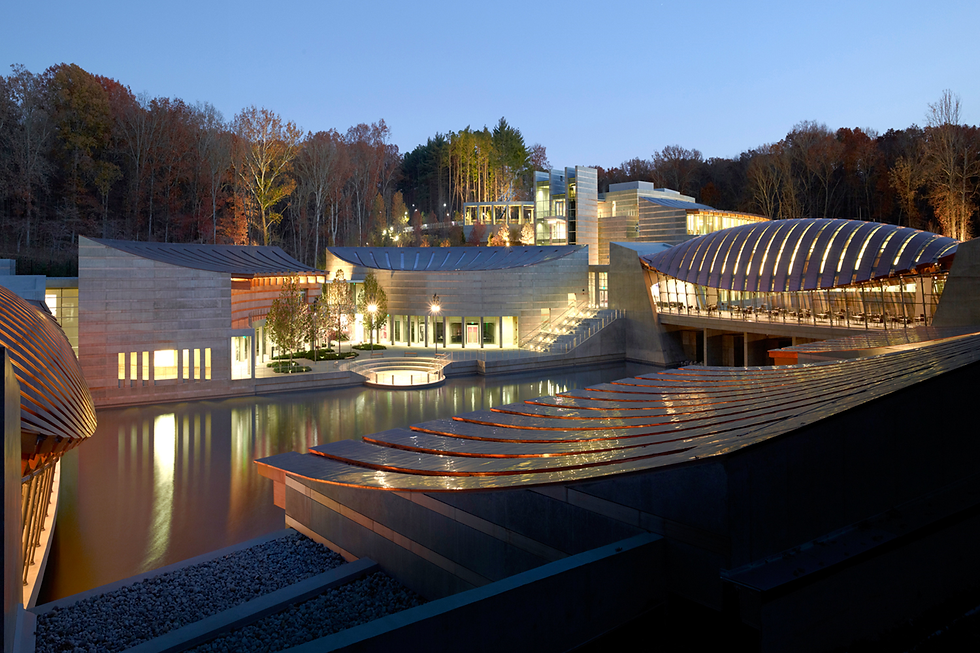 Crystal Bridges Museum of American Art illuminated at night in Bentonville, Arkansas.