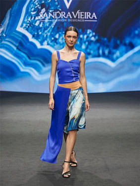Professional model Lina Kholodova walking the runway inside the Black Box at Tenerife Moda Fashion Week SIMTE 2026 high fashion show.