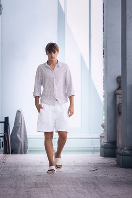 Leonardo Russo new face male model wearing a casual striped shirt and summer shorts outdoor lifestyle fashion shoot Salitre Models
