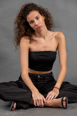 Full-body color studio photograph of fashion model Mireya Garcia, showcasing her 1.75m height, physical proportions, and professional posing in a clean studio environment.