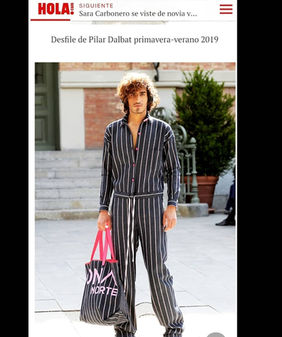 Male fashion model Reda Akalay on the MBFW Madrid runway for Pilar Dalbat, featured in the official Hola Magazine coverage.