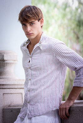 Leonardo Russo new face male model wearing a casual striped shirt and summer shorts outdoor lifestyle fashion shoot Salitre Models