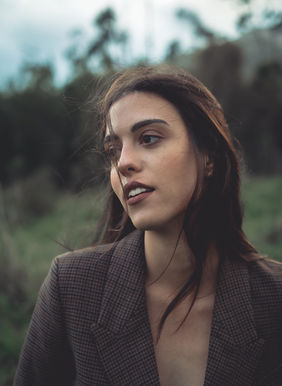 Laura Lopez model Spain posing outdoor green countryside editorial wearing elegant tailored pantsuit jacket and trousers Salitre Models