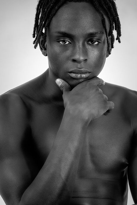 Black and white casting polaroid of Black male model Jimmy Brown in underwear boxers. Full-body shot showcasing his defined abs, muscular physique, and athletic proportions.
