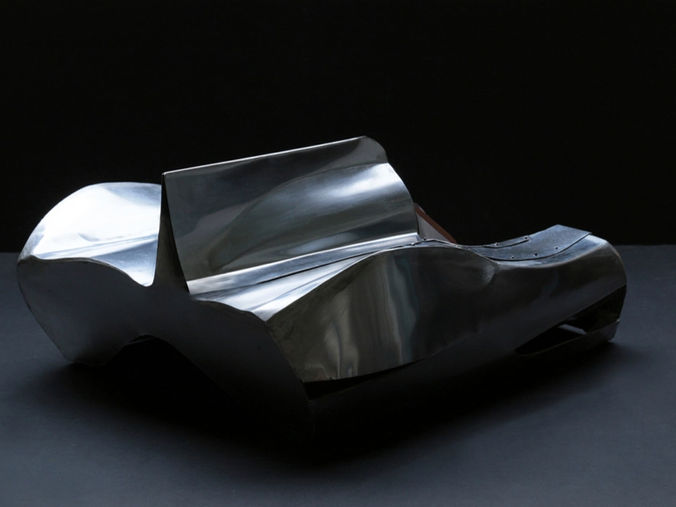 Marc-Richard Mulsanne convertible seat in polished metal—Jaguar D-Type inspired design with removable fairing and sculptural tailfin form.