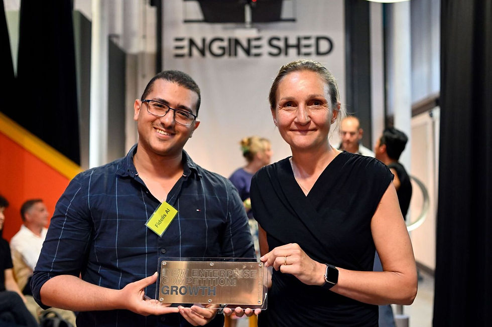 Dr. Abanoub Ghobrial, CEO of Fidelis AI, collecting New Enterprise Competition award.