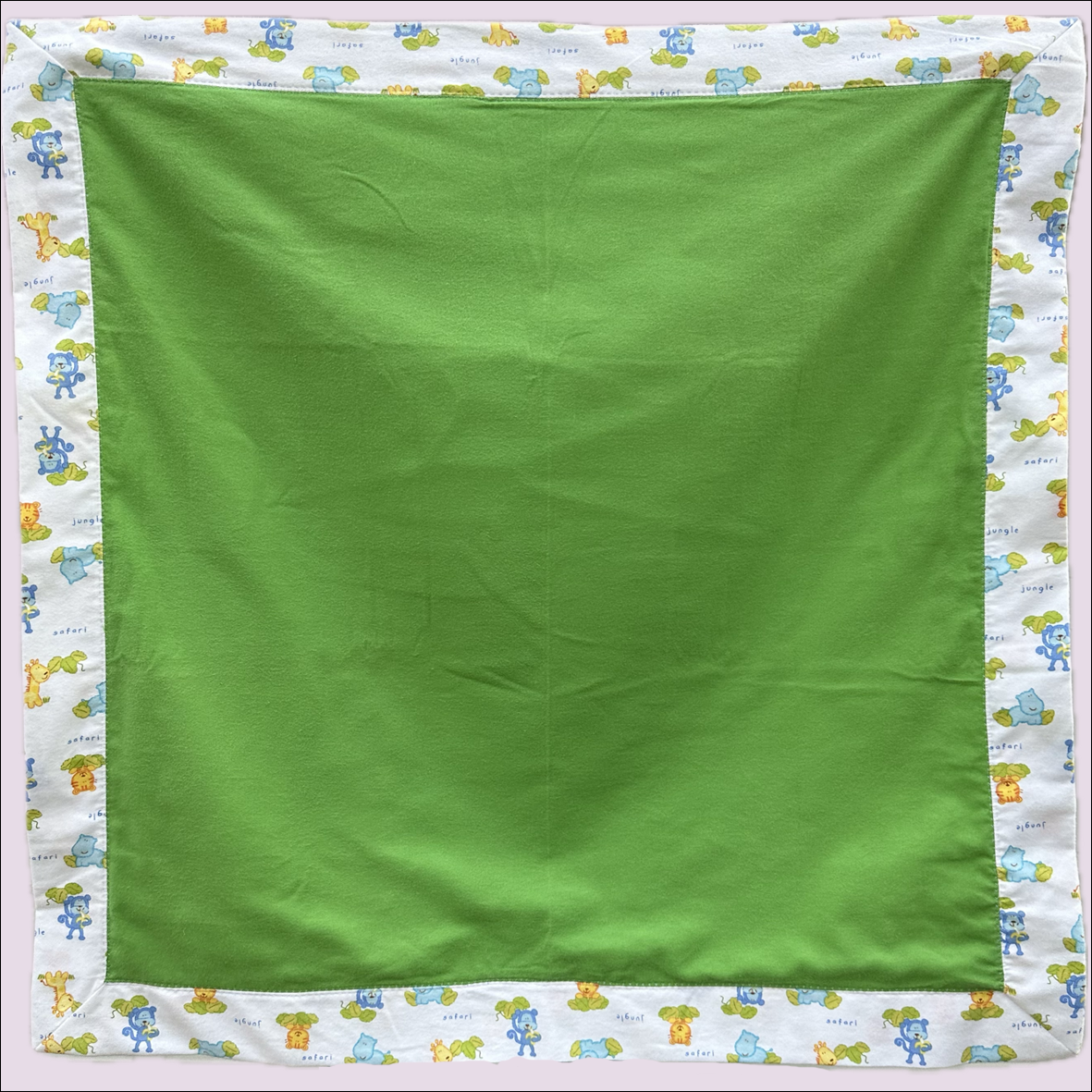FLANNEL BLANKET - Green with Jungle Babies Border/Back