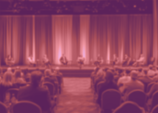 kingmeeeech_a_stage_set_with_a_coperate_background._attendees_b604a636-0482-4603-9f99-3d70