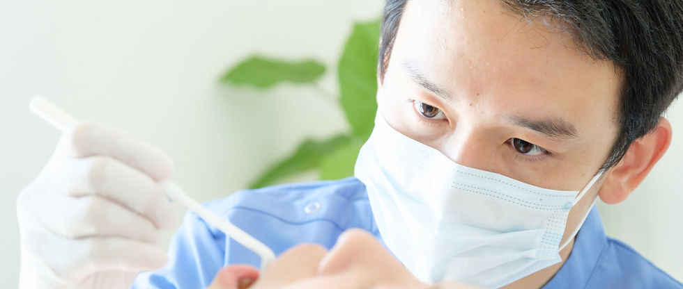 young%20dentist%20treating%20patient%20teeth%20at%20dental%20hospital_edited.jpg