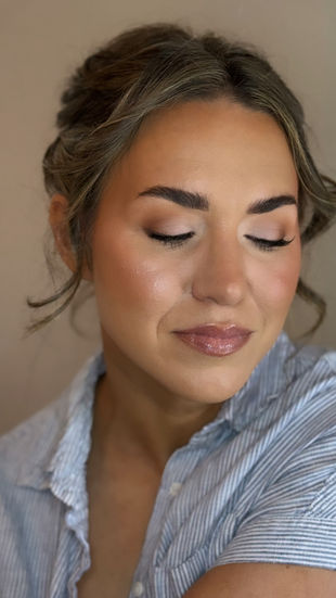 Close-up of bride with eyes closed showing soft glam bridal makeup at a wedding venue located in Durham called The Rickhouse