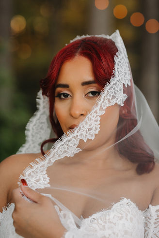 Bride wearing full glam wedding makeup by ELVTD Beauty in North Carolina at the Greenhouse Arrow Farms in Lillington, NC