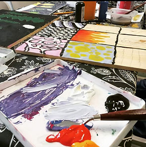 A photo of the shared studio, showing the artist's tools and paints