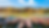 Wide photo of 11 wooden boats along Ho An's waterway.