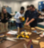 Richardson and seventh-grade students working on the construction phase of the birdhouse.