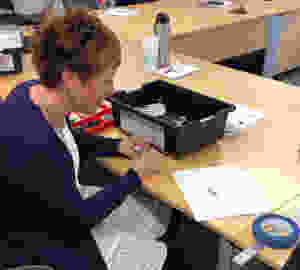 Smith working on constructing the Lego Mindstorms robot at Volkswagen Chattanooga.