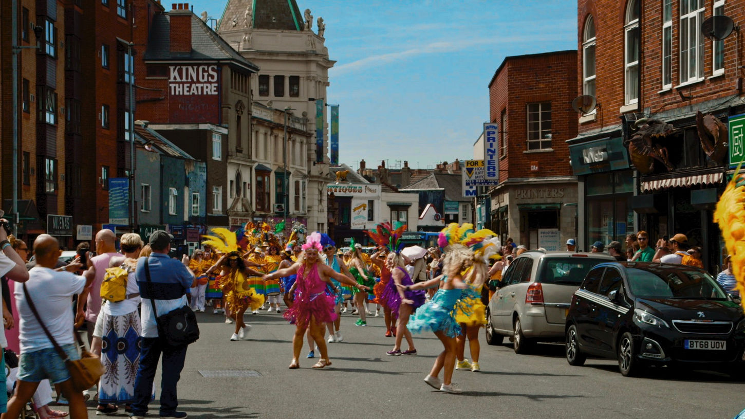Dancers on the street, theatre in background