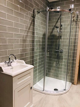 Modern bathroom with a glass shower enclosure and chrome fixtures