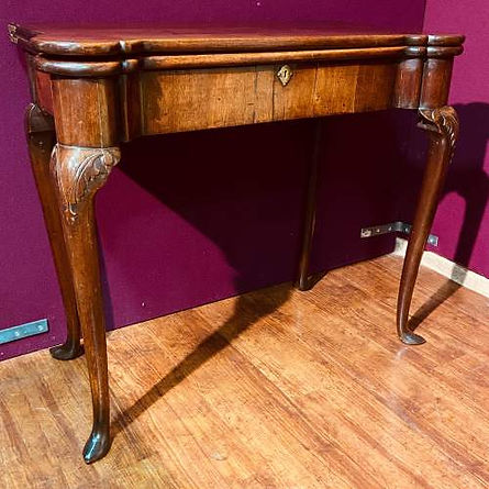 Antique wooden console table with curved legs and ornate carvings